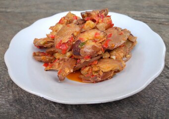 Jengkol balado is a traditional indonesian food. Made from jengkol seeds or dogfruit cooked with balado or spicy chili sauce. Other name is sambal jengkol.