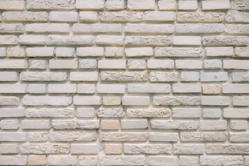 Obraz premium White brick wall with slight roughness and imperfections adds depth to clean appearance