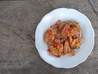 Jengkol balado is a traditional indonesian food. Made from jengkol seeds or dogfruit cooked with balado or spicy chili sauce. Other name is sambal jengkol.