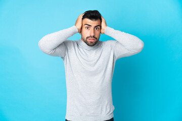 Caucasian man over isolated blue background doing nervous gesture