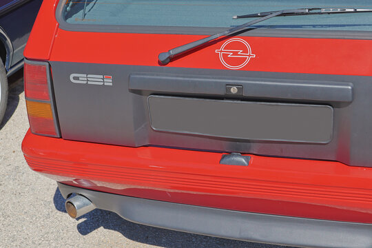 Opel corsa gsi red car parked showing rear view with logo