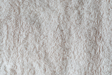 Clothing fabric white microfiber texture background, close up of cloth textile surface abstract.
