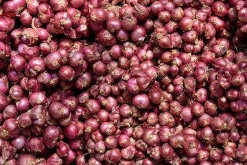 a container full of shallots sold in traditional markets