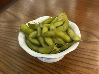 Japanese edamame, vegetable soybean, green soybean with bowl on wooden table