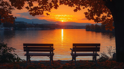 Fototapeta premium Two wooden benches on a lake shore at sunset
