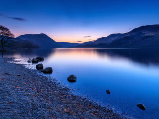 landscape of a lake after sunset