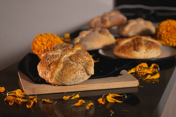 Pan de Muerto. Typical Mexican sweet bread that is consumed in the season of the day of the dead. It is a main element in the altars and offerings in the festivity of the day of the dead.