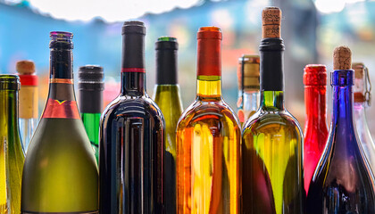 A vibrant and colorful close-up of various wine bottles with blurred background