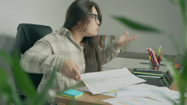 Annoyed stressed businesswoman mad about online problem, failed software application, laptop data loss or stuck computer virus slowing system working with notebook and papers leaving office workplace
