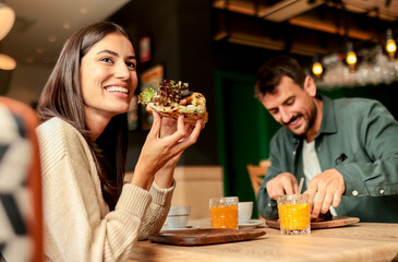 Enjoying a delightful brunch together at a cozy cafe on a sunny afternoon in the heart of the city