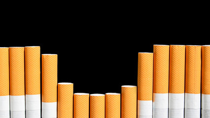 Cigarettes on the black background with copy space. Smoking cessation and quitting concept. World no tobacco day.