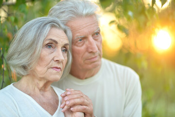 Portrait of beautiful senior couple posing in the park