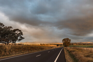Rural New South Wales country road with stormy sky