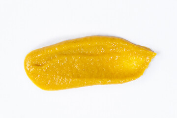 Smear of mustard sauce on white background isolate, creativity in cooking, macro texture