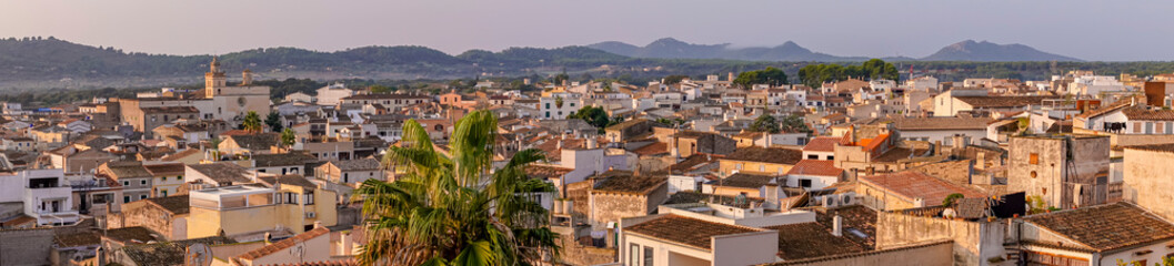 Obraz premium Aerial panoramic view of the Mallorcan town of Arta, on the island of Mallorca at sunrise. Spain