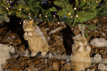 New Year's decorations, toys and garlands in fabulous settings. Toy animals for children in a public place.