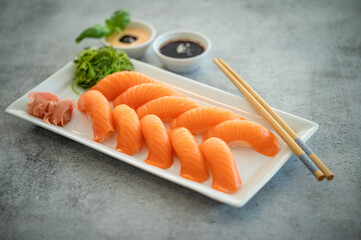 Fresh Sushi Roll with salmon.Japanese food. Copyspace black background.