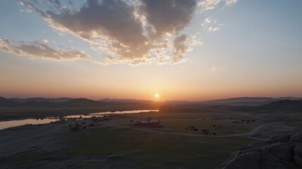Obraz premium Breathtaking Sunset Over Rolling Hills and a Serene Lake