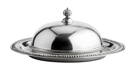 Silver serving cloche raised above empty silver plate isolated on white