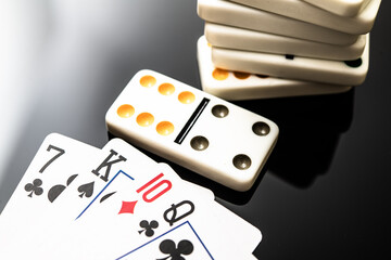 Playing Cards and Dominoes: A Close-Up Snapshot of Classic Gaming Elements for Family Fun and Gathering