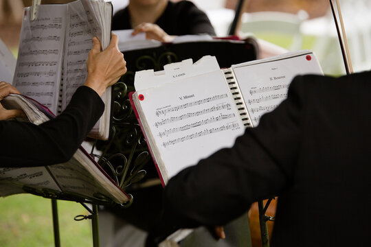 sheet music on stands outdoors