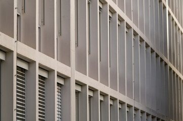 long rows of windows of an office building from the 1960s