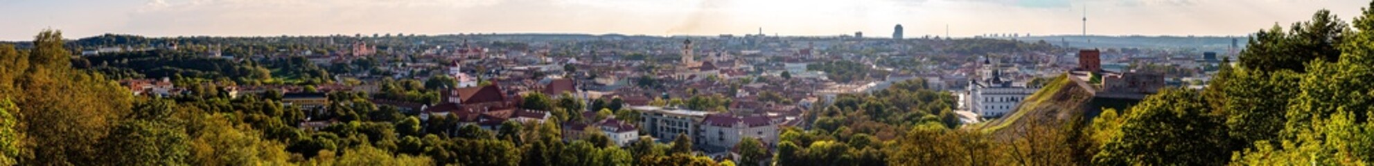Fototapeta premium Panorama view on a sunny day over Vilnius with old churches, river and TV Tower, Lithuania