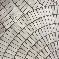 The background of gray and white square stones arranged like a fan, paved as a path for people.