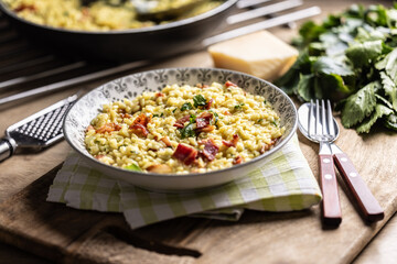 Italian risotto with pancetta, parmesan and parsley on a stylish plate
