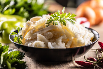 Precooked beef tripes in a bowl with vegetables and herbs ready for cooking