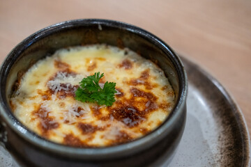 Mashed potato with cheese on top, serve in a bowl