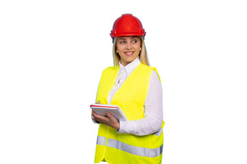 Smiling female construction engineer in a safety helmet