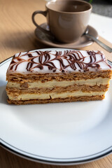 Portion of french mille-feuille cake, vanilla or custard slice, Napoleon puff pastry layered with pastry cream in bakery