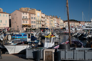 Old port of Saint-Tropez famous touristic village on French Riviera, summer vacation with large...