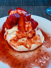 Sweet french dessert, Red strawberry fruit pavlova served in restaurant in Saint-Tropez, France