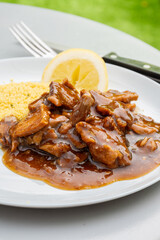Meat dish Caramel pork served with couscous