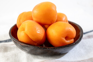 Bowl with red ripe sweet apricots fruits, harvest in Vaucluse, Provence, France