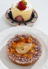 Red fruit sweet dessert cheesecake tart with fresh strawberries in bakery