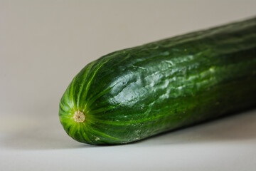 Product close-up of a green whole fresh cucumber