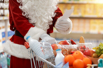 Santa Claus doing grocery shopping at the supermarket