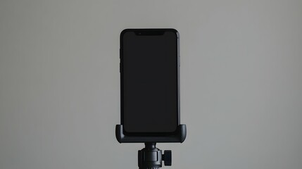 Smartphone with Black Screen on Tripod  Isolated on Grey Background