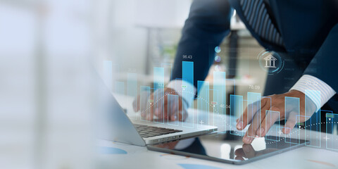 Finance and data analysis. Businessman doing investment and financial analytics utilizing...