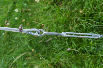 Steel cable end with clamp attached to the turnbuckle