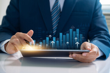 Businessman use financial analytics and investment strategies leveraging digital technology to...