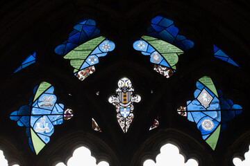 Stained glass windows light shining through inside old building architecture