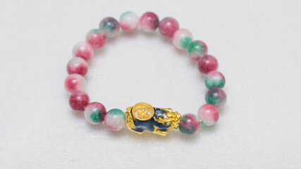 Natural gemstone bracelet display on white bqackground