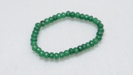 Natural gemstone bracelet display on white bqackground