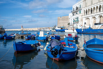 Obraz premium Colorful fishing boats in Monopoli harbor in Italy