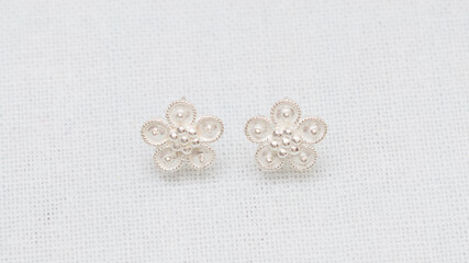 Hmong or Miao handmade silver jewelry on white background