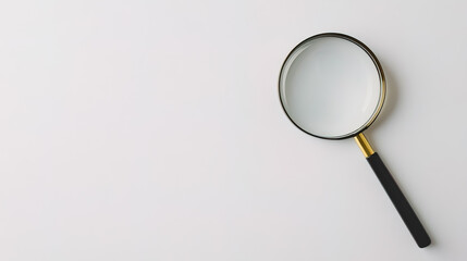 A high-quality photo of a magnifying glass placed against a plain white background.